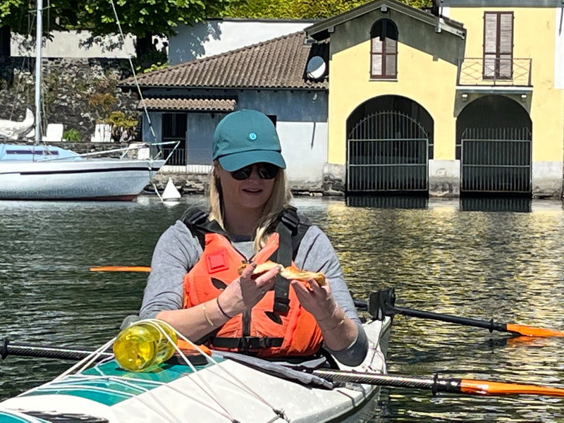 Kayaker eating focacia