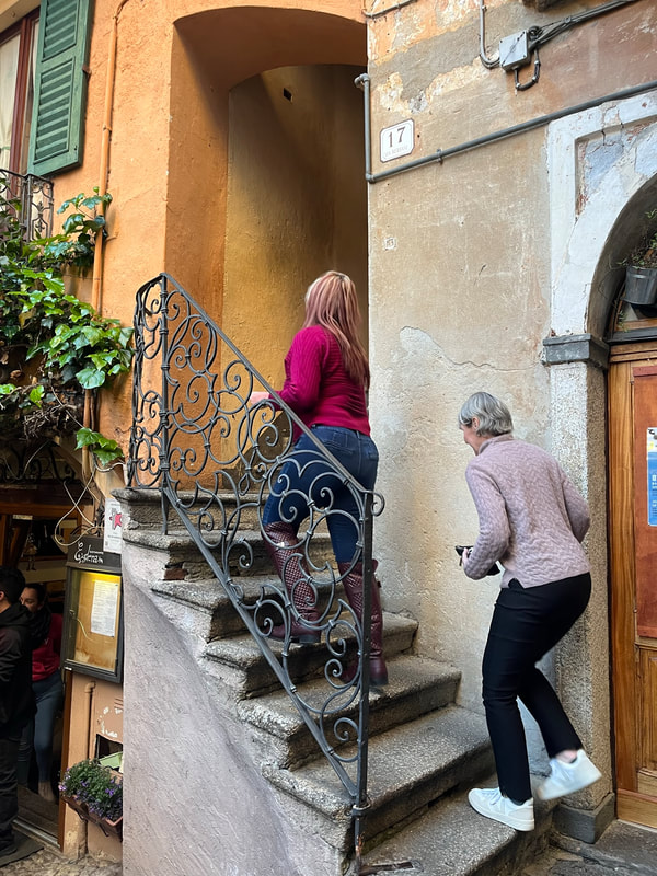 Women going up stairs to restaurant. 