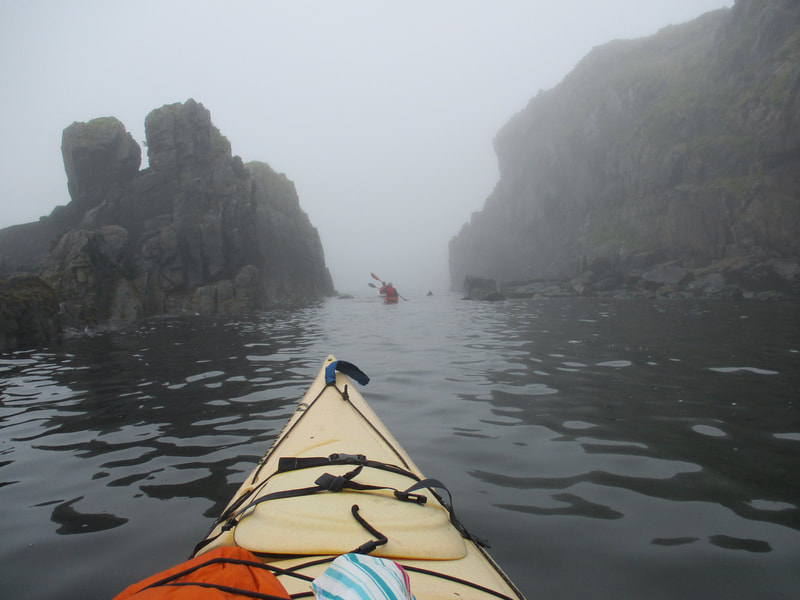 Kayaks in the fog