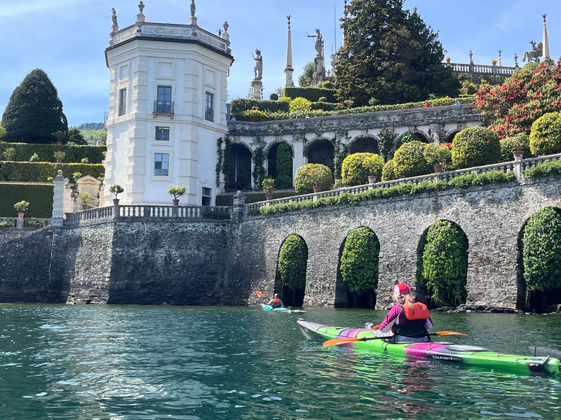 Kayaker views gardens on Lake Maggiore.