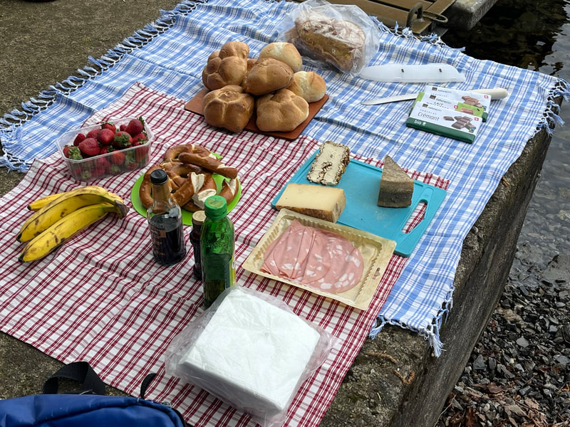 A picnic lunch with meat and cheese. 
