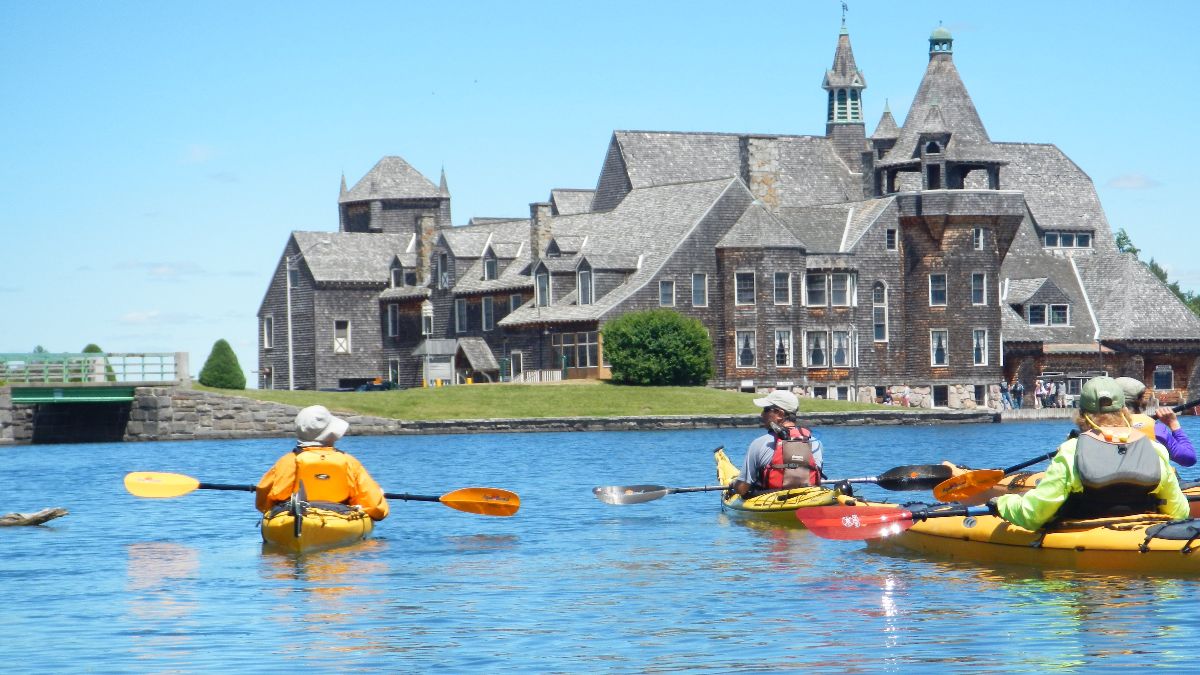 Kayakers looking at the Boldt Castle Yacht House in the 1000 Islands
